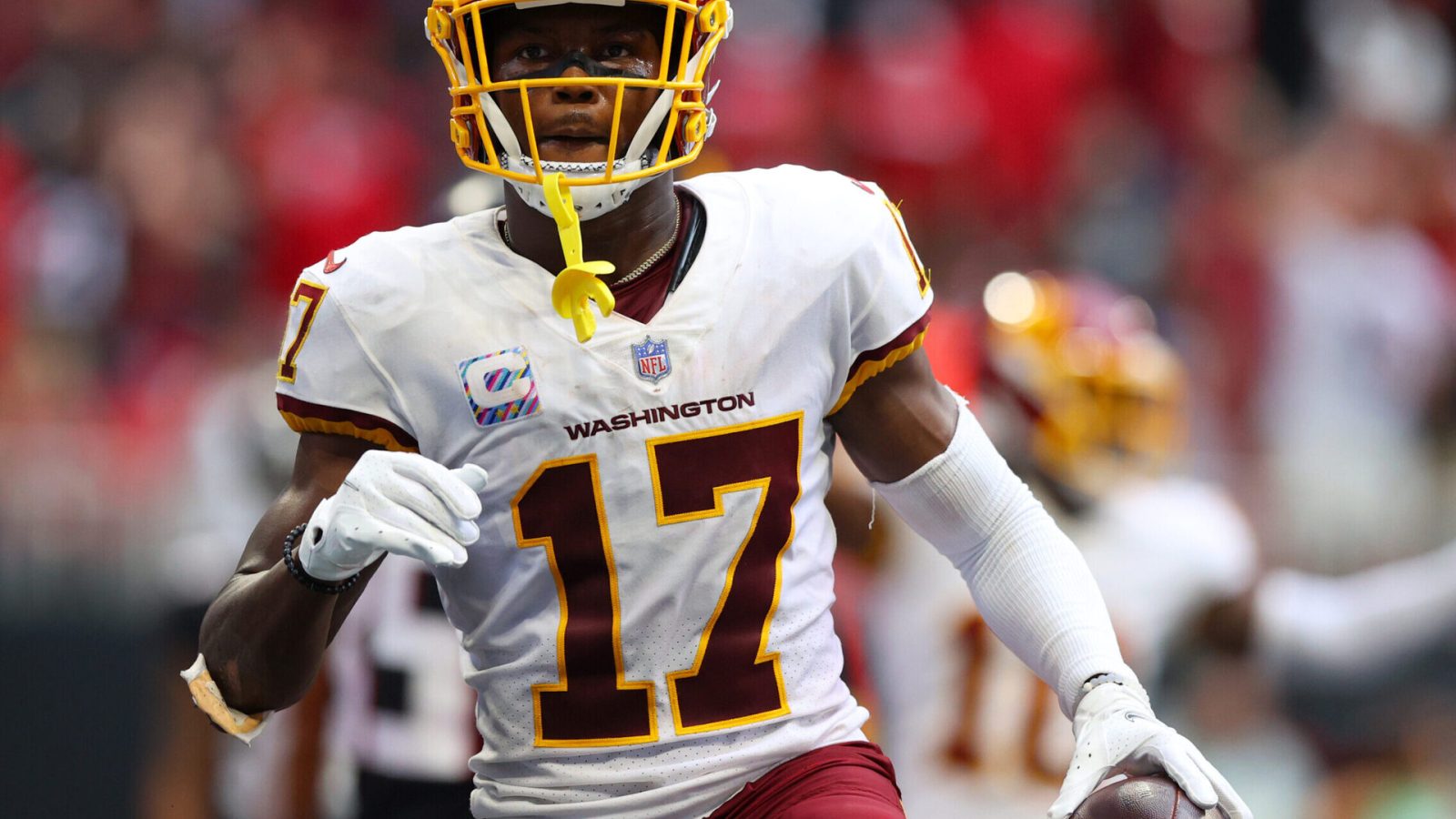 Washington Football Team wide receiver Terry McLaurin holds the football in his left hand after scoring a touchdown
