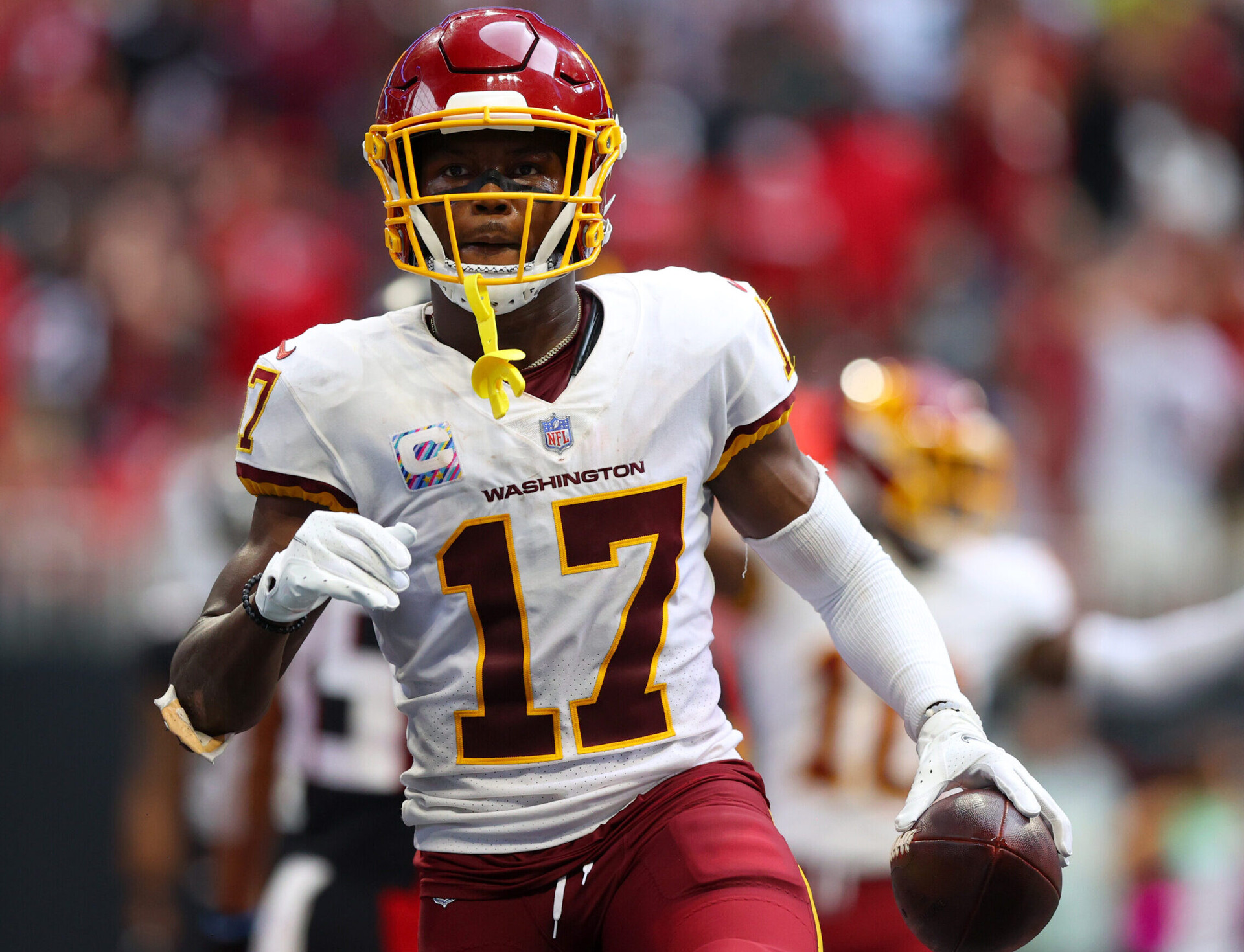 Washington Football Team wide receiver Terry McLaurin holds the football in his left hand after scoring a touchdown