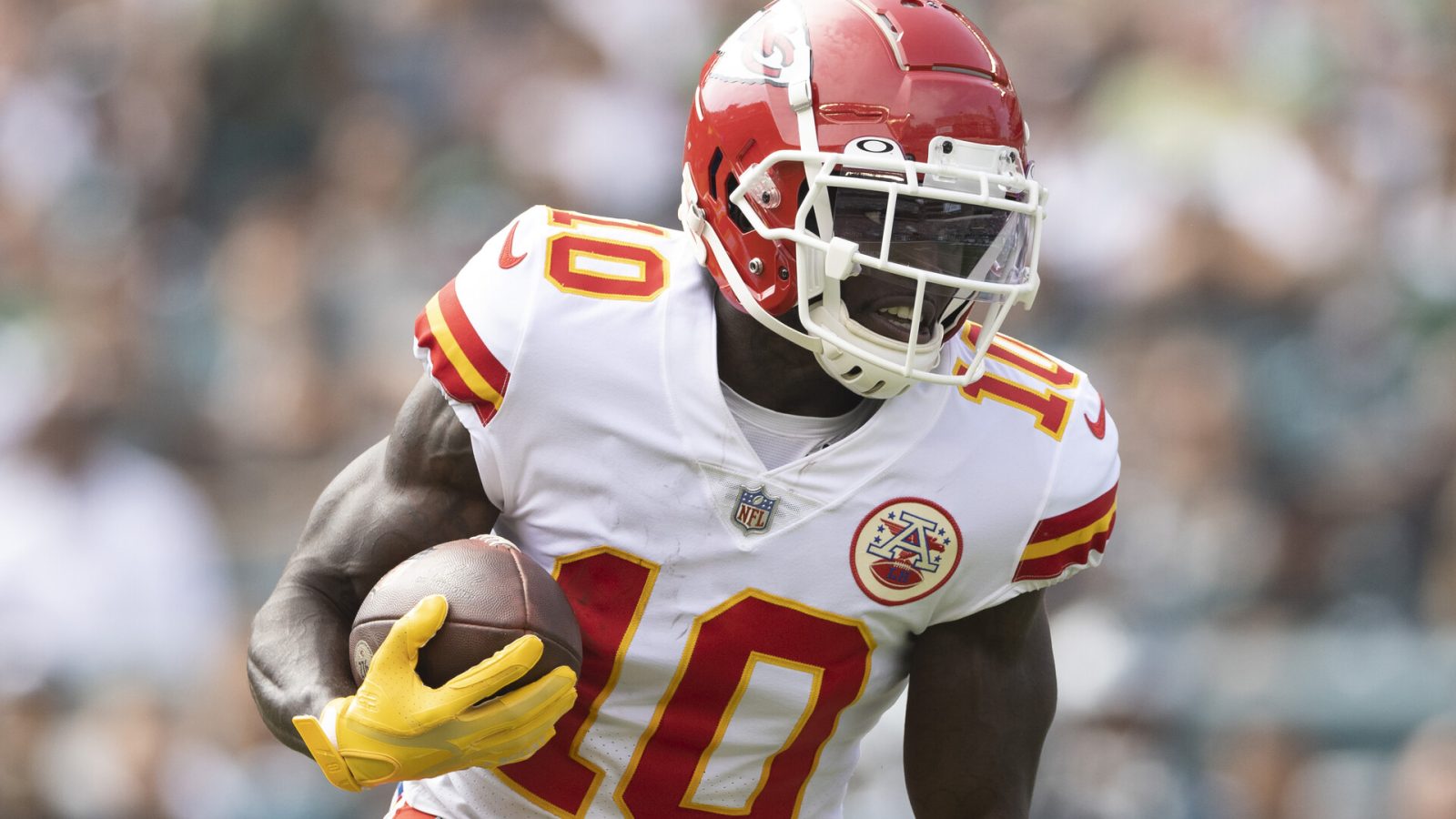 Kansas City Chiefs wide receiver #10 Tyreek Hill turns upfield for running room in a 2021 road game.