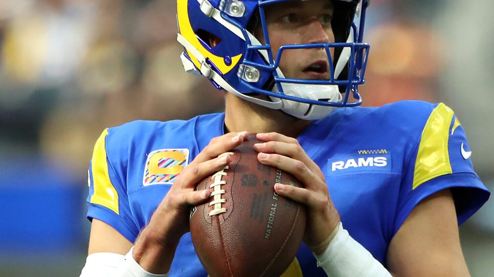 Los Angeles Rams quarterback #9 Matthew Stafford looks downfield in a 2021 home game.