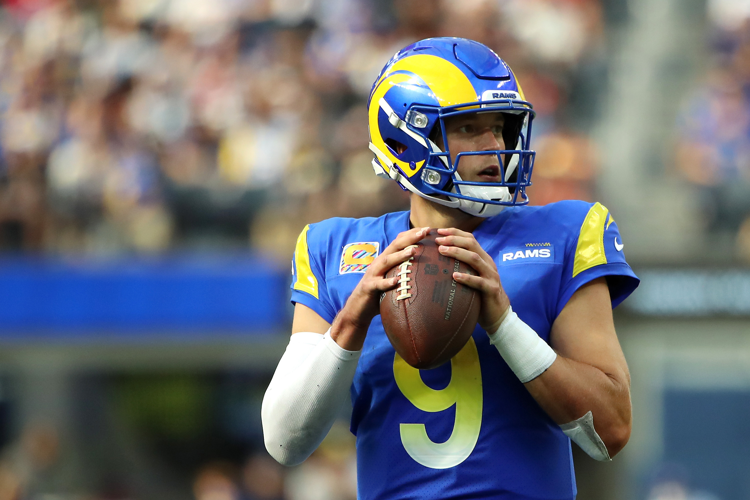 Los Angeles Rams quarterback #9 Matthew Stafford looks downfield in a 2021 home game.