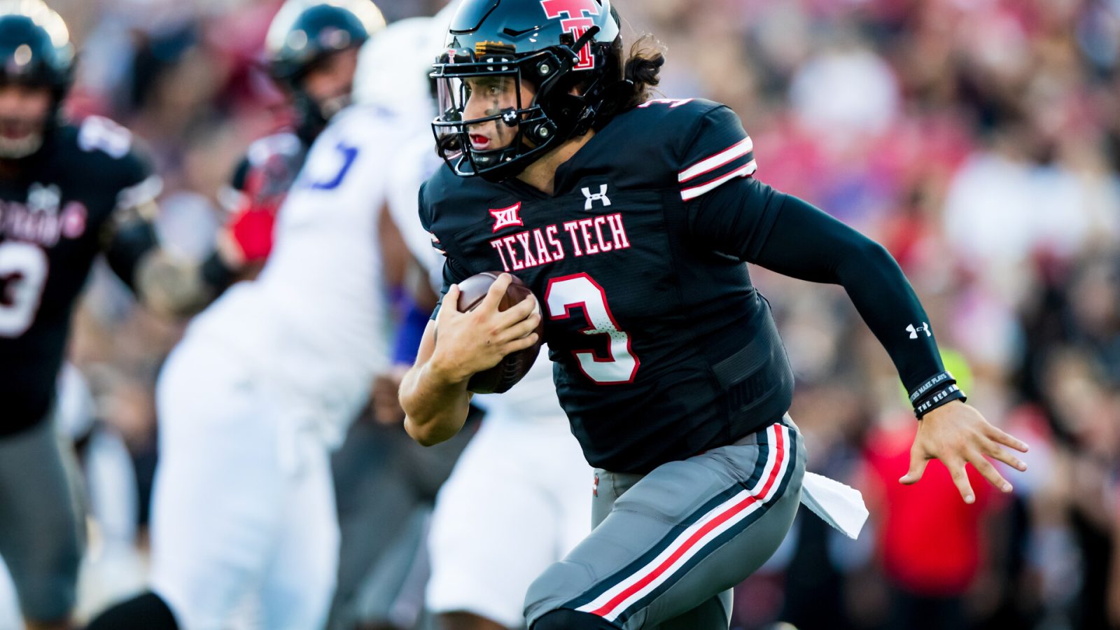Henry Colombi #3 QB for Texas Tech looks for running room.