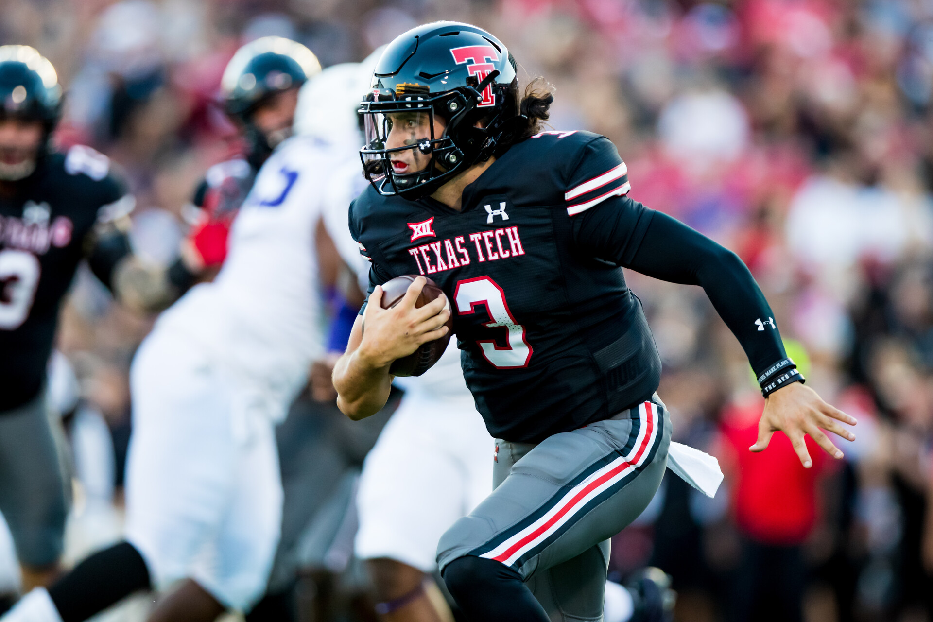 Henry Colombi #3 QB for Texas Tech looks for running room.