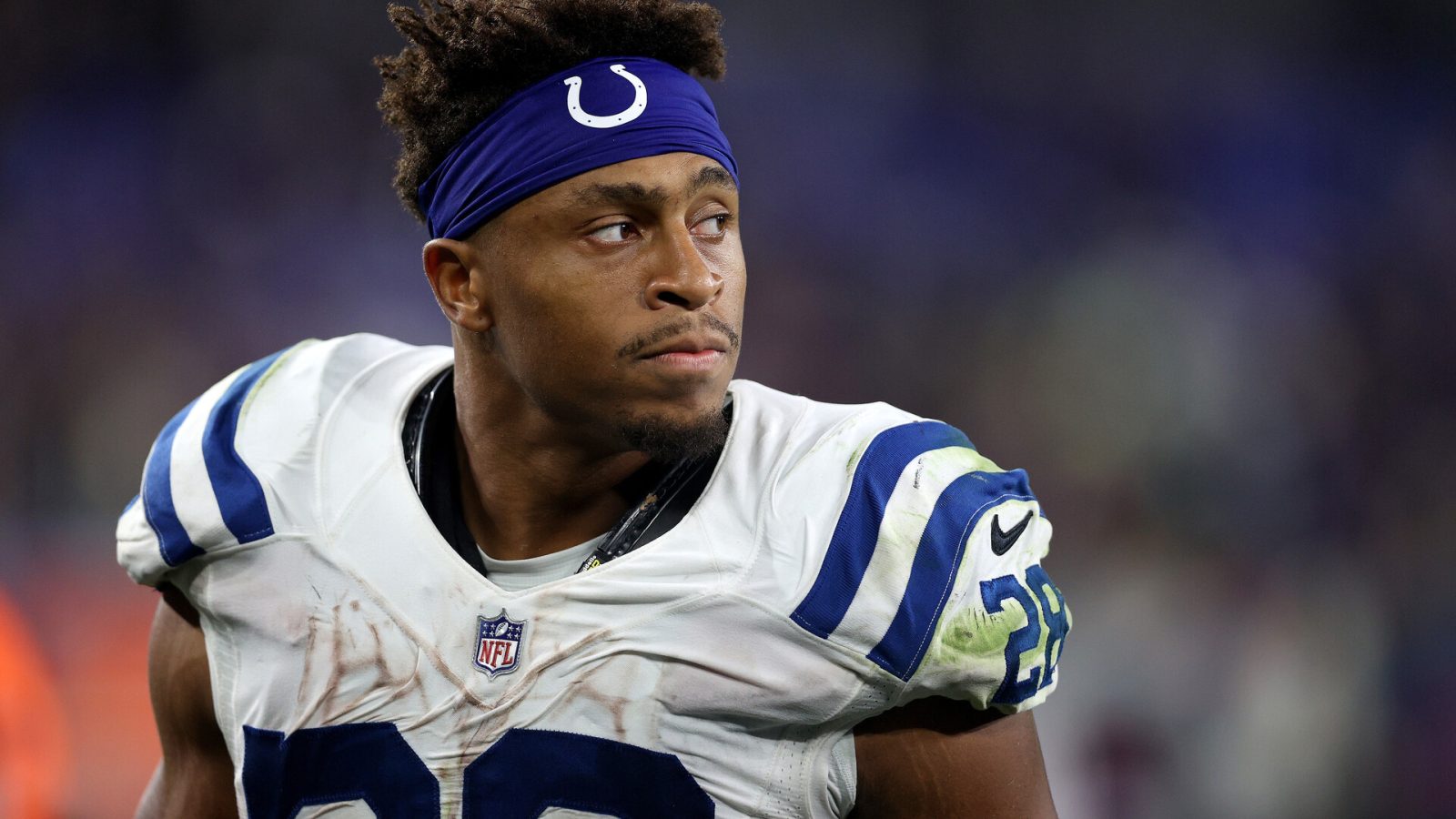 Indianapolis Colts running back #28 Jonathan Taylor looks from the sideline in a 2021 game.