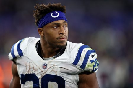 Indianapolis Colts running back #28 Jonathan Taylor looks from the sideline in a 2021 game.