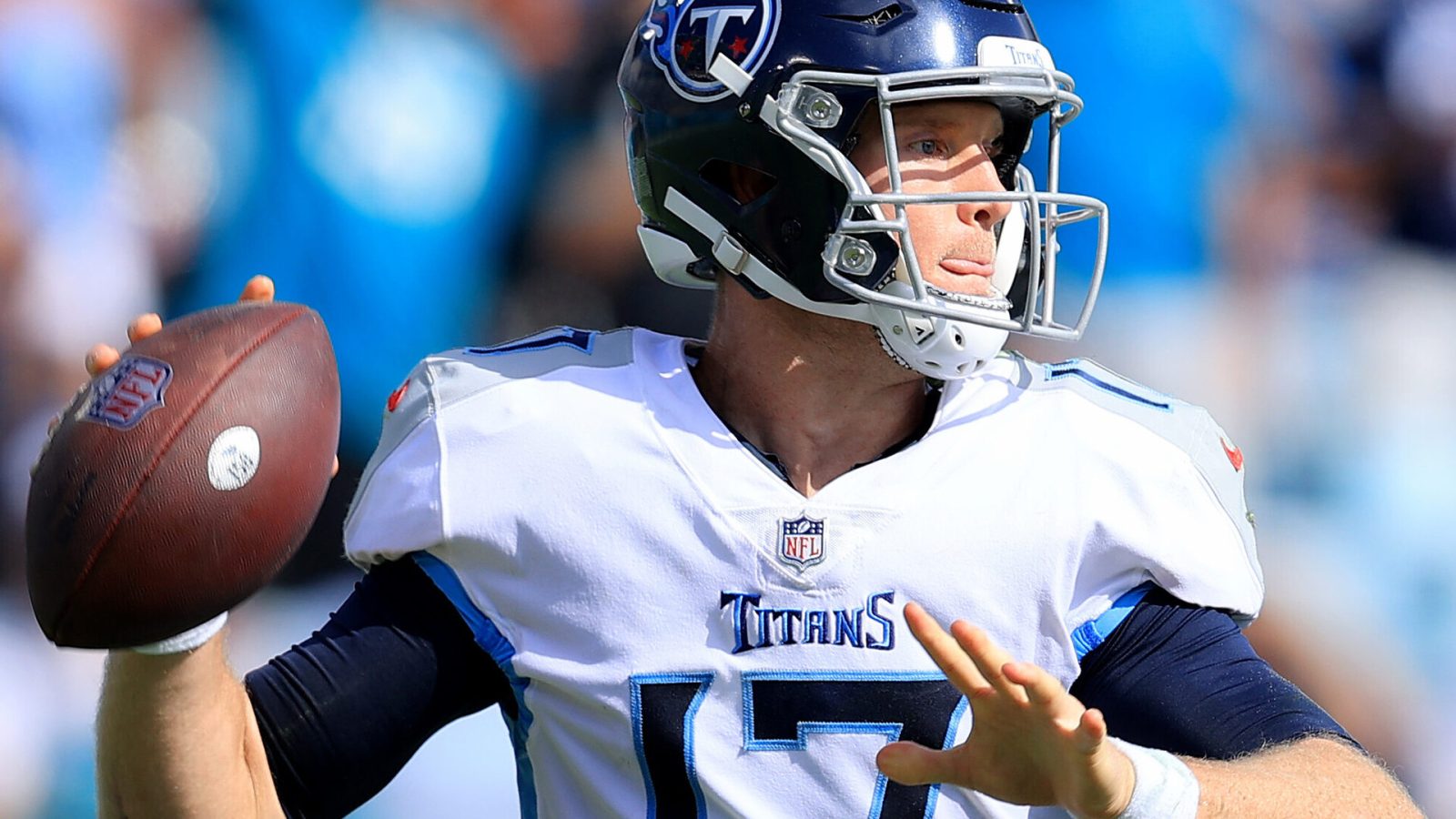 Tennessee Titans quarterback #17 Ryan Tannehill looks downfield in a 2021 game.