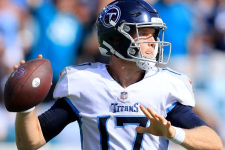 Tennessee Titans quarterback #17 Ryan Tannehill looks downfield in a 2021 game.