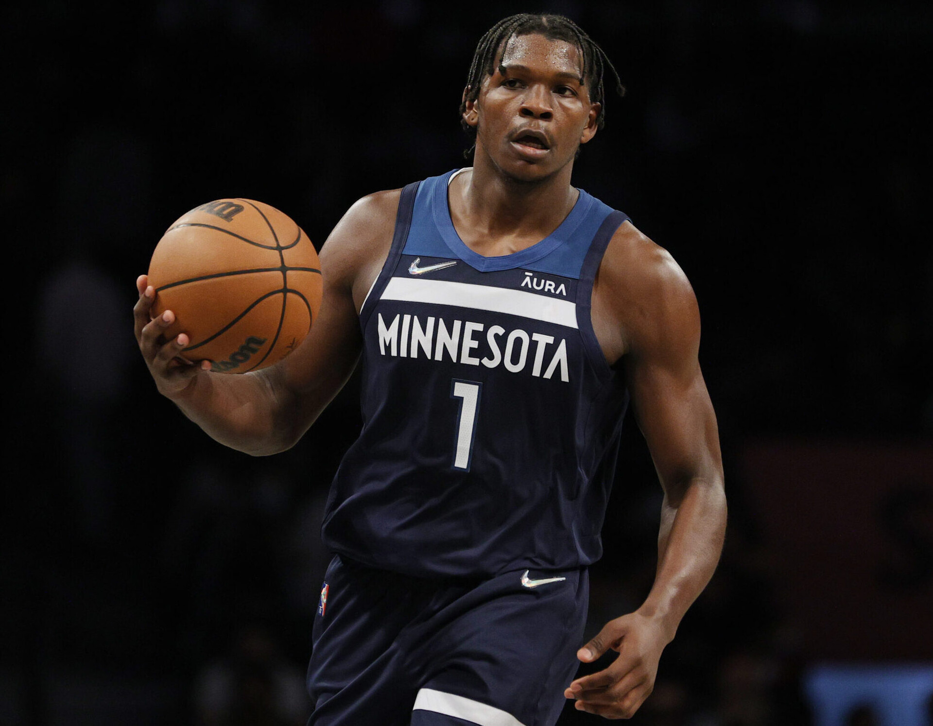 Minnesota Timberwolves guard Anthony Edwards brings the ball up the court in a 2021 game.