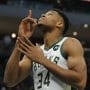 Best NBA Props - Milwaukee Bucks forward Giannis Antetokounmpo points to the sky before the start of a game