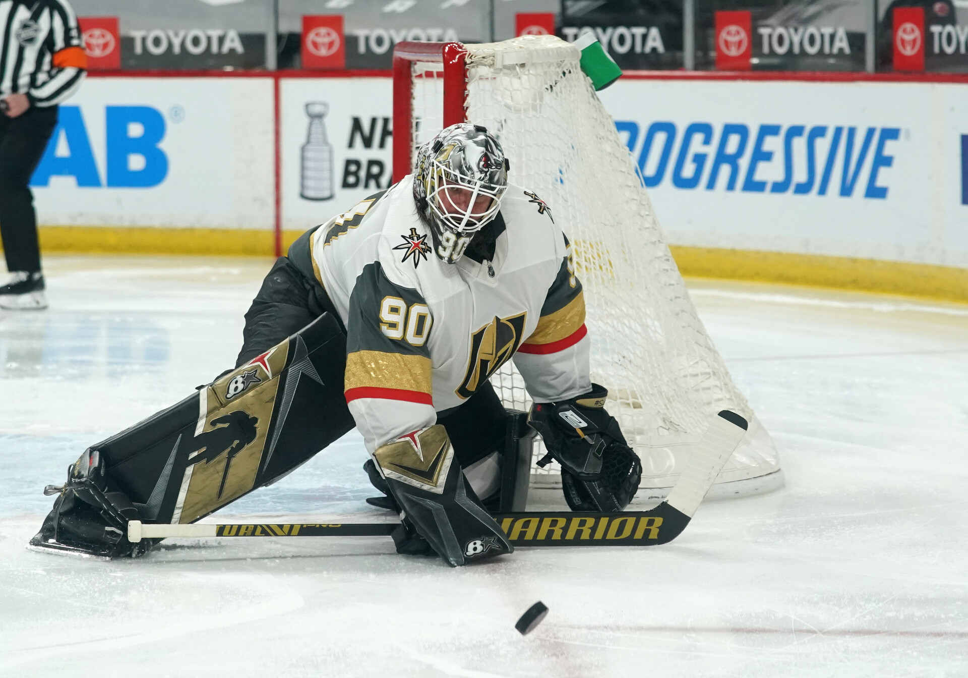 Vegas Golden Knights goaltender Robin Lehner drops his stick to the ice to make a save on the puck