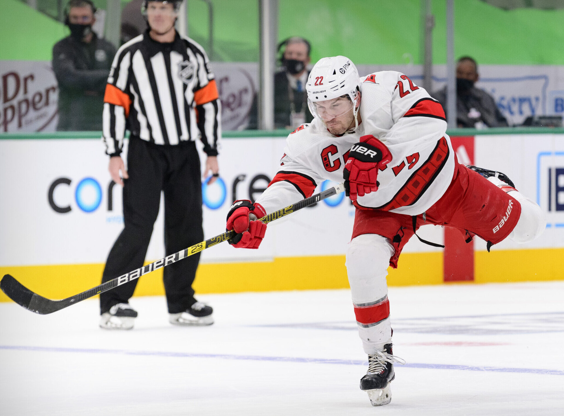 Carolina Hurricanes defenseman Brett Pesce takes a shot in an NHL game against the Dallas Stars