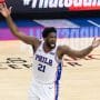 Philadelphia 76ers center Joel Embiid waves his arms after scoring