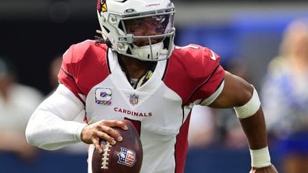 Arizona Cardinals quarterback Kyler Murray rolls out to pass
