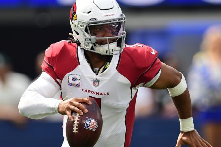 Arizona Cardinals quarterback Kyler Murray rolls out to pass