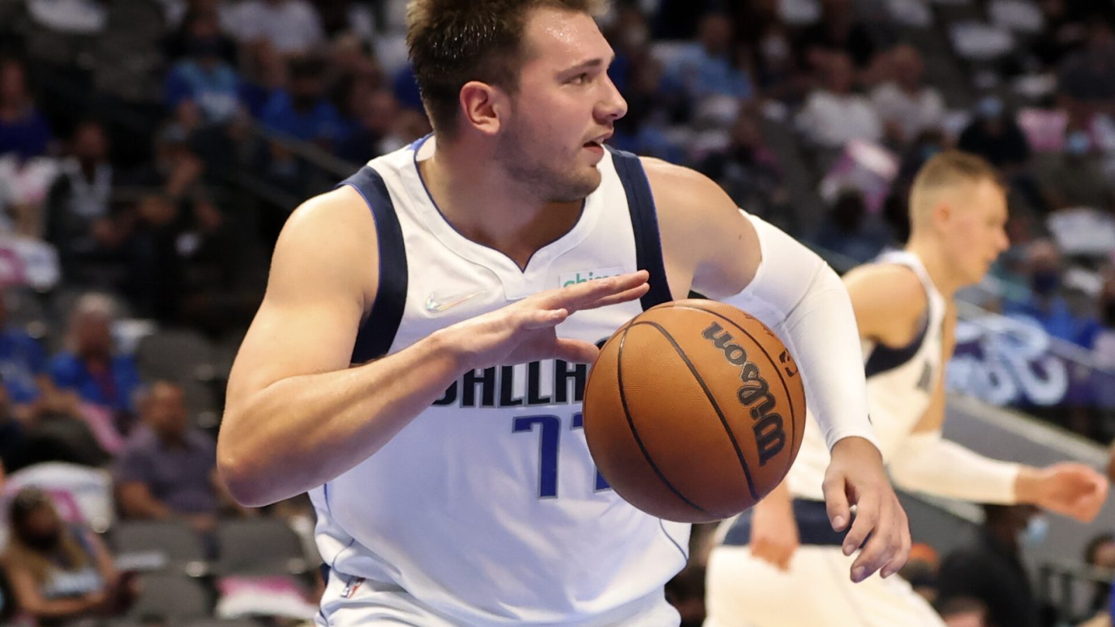 Dallas Mavericks player Luka Doncic dribbles the basketball after grabbing a rebound