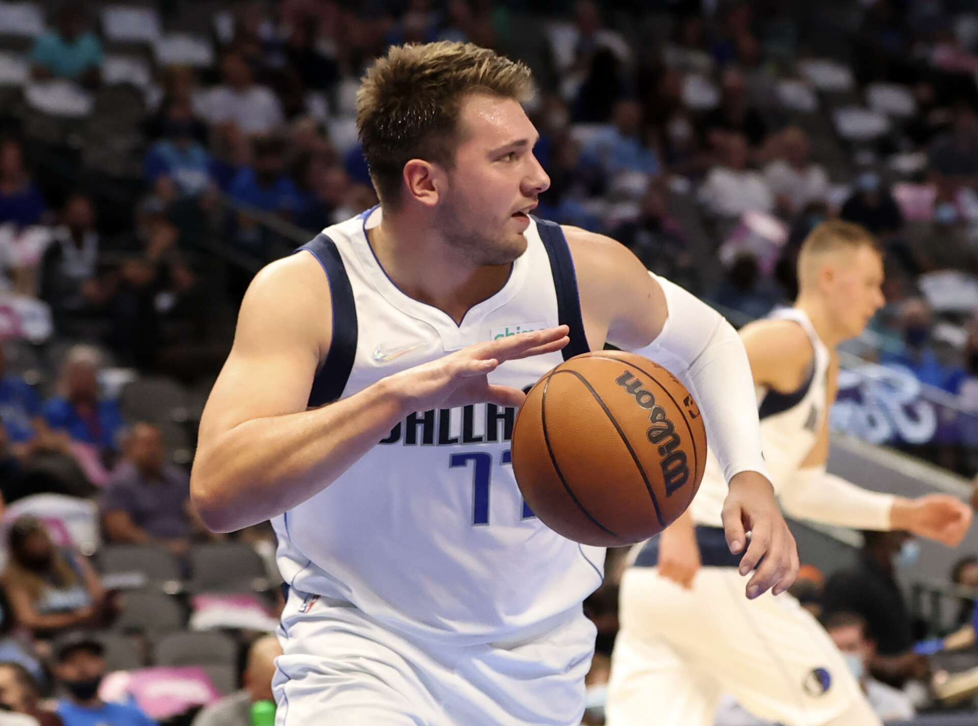 Dallas Mavericks player Luka Doncic dribbles the basketball after grabbing a rebound