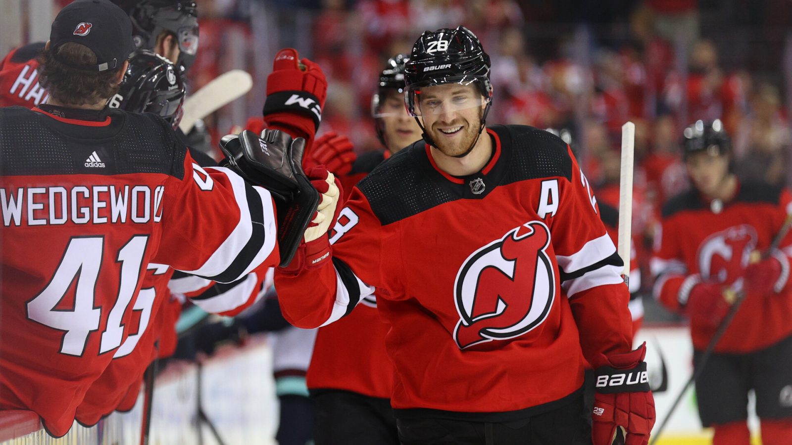 New Jersey Devils defenseman Damon Severson celebrates with teammates after scoring a goal