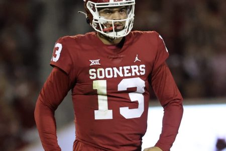 Oklahoma Sooners quarterback Caleb Williams pumps his fists below his waist after throwing a touchdown pass against TCU.