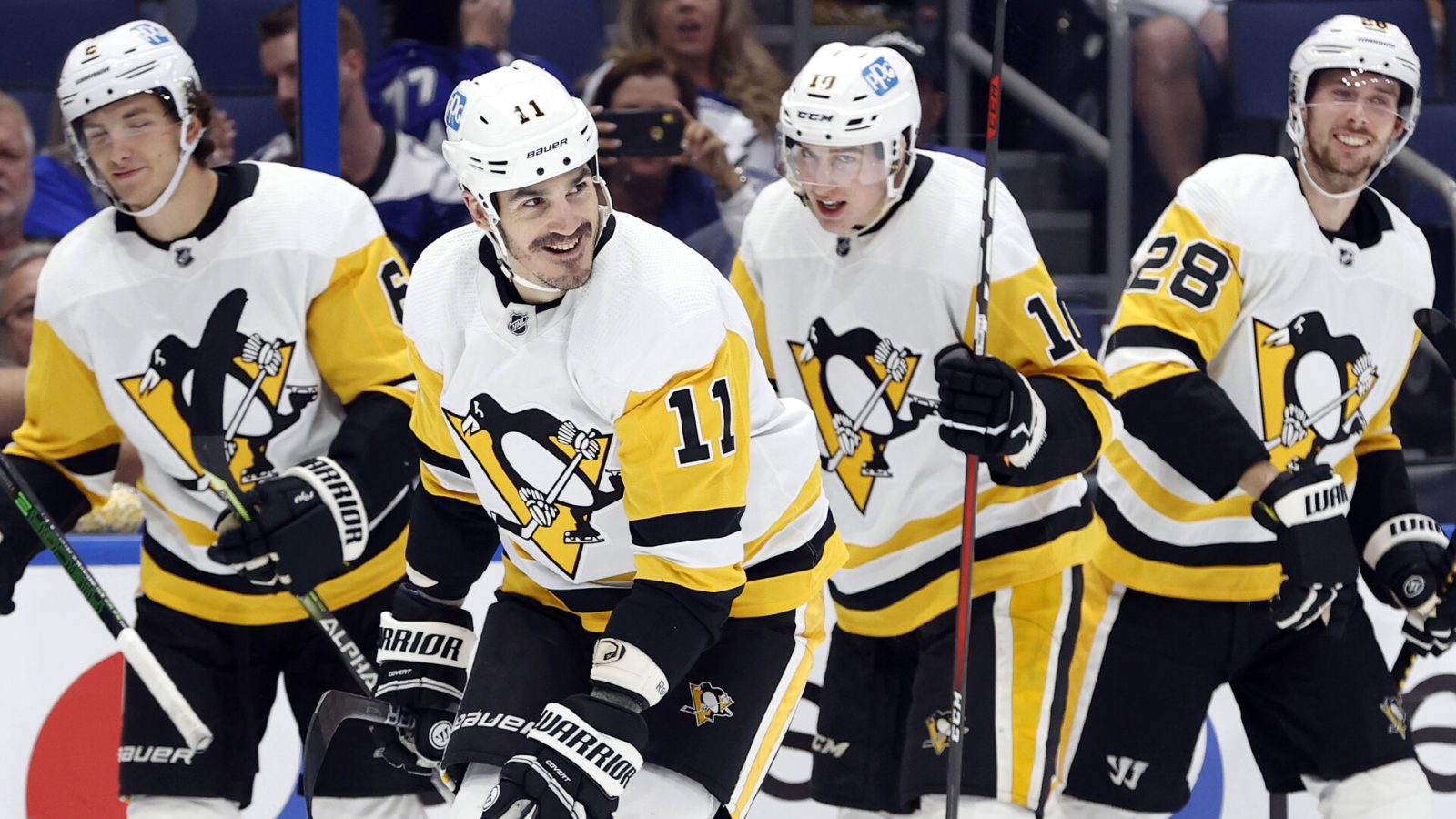 Pittsburgh Penguins teammates celebrate a goal