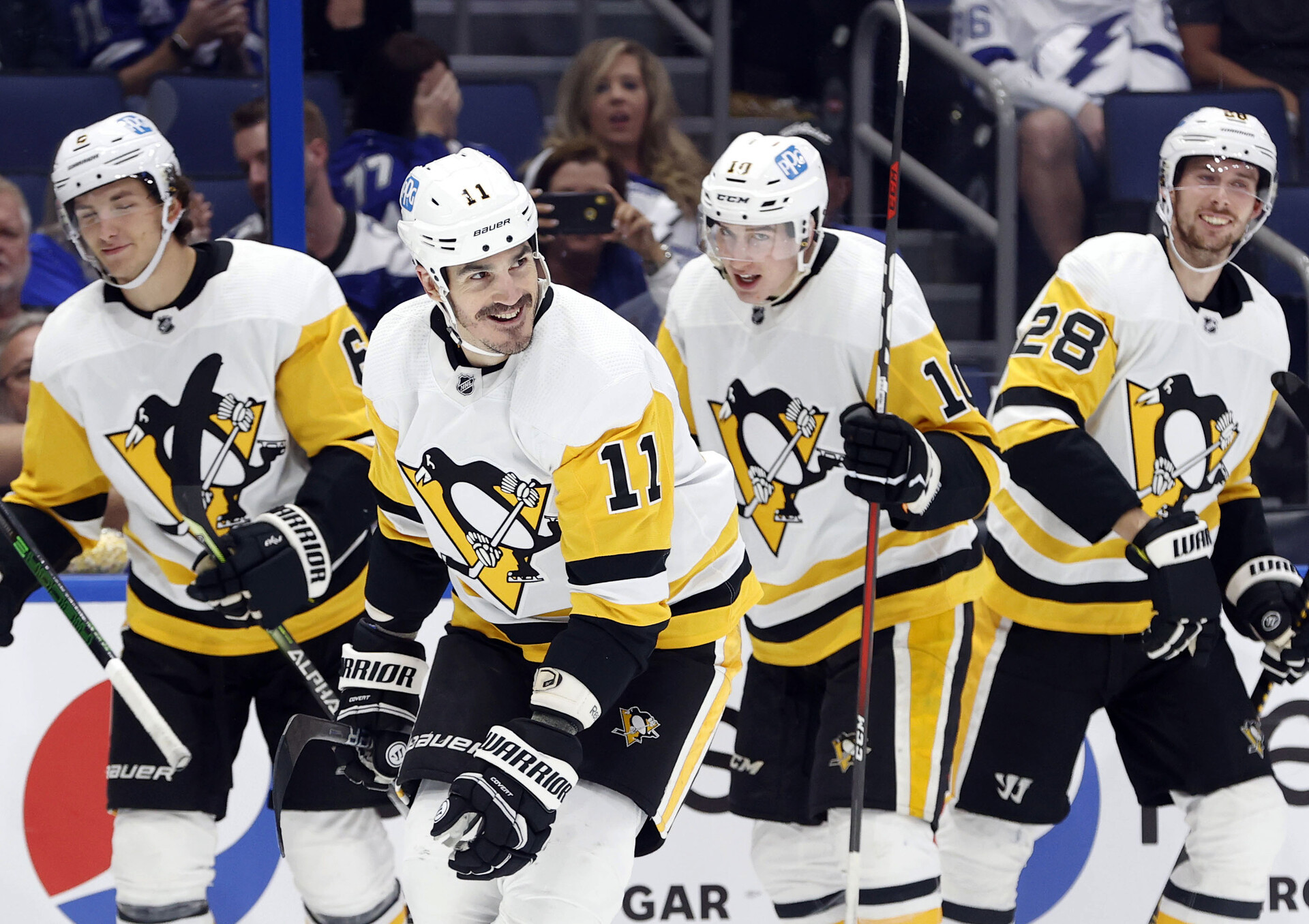 Pittsburgh Penguins teammates celebrate a goal