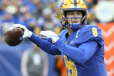 University of Pittsburgh quarterback Kenny Pickett winds up to throw a pass