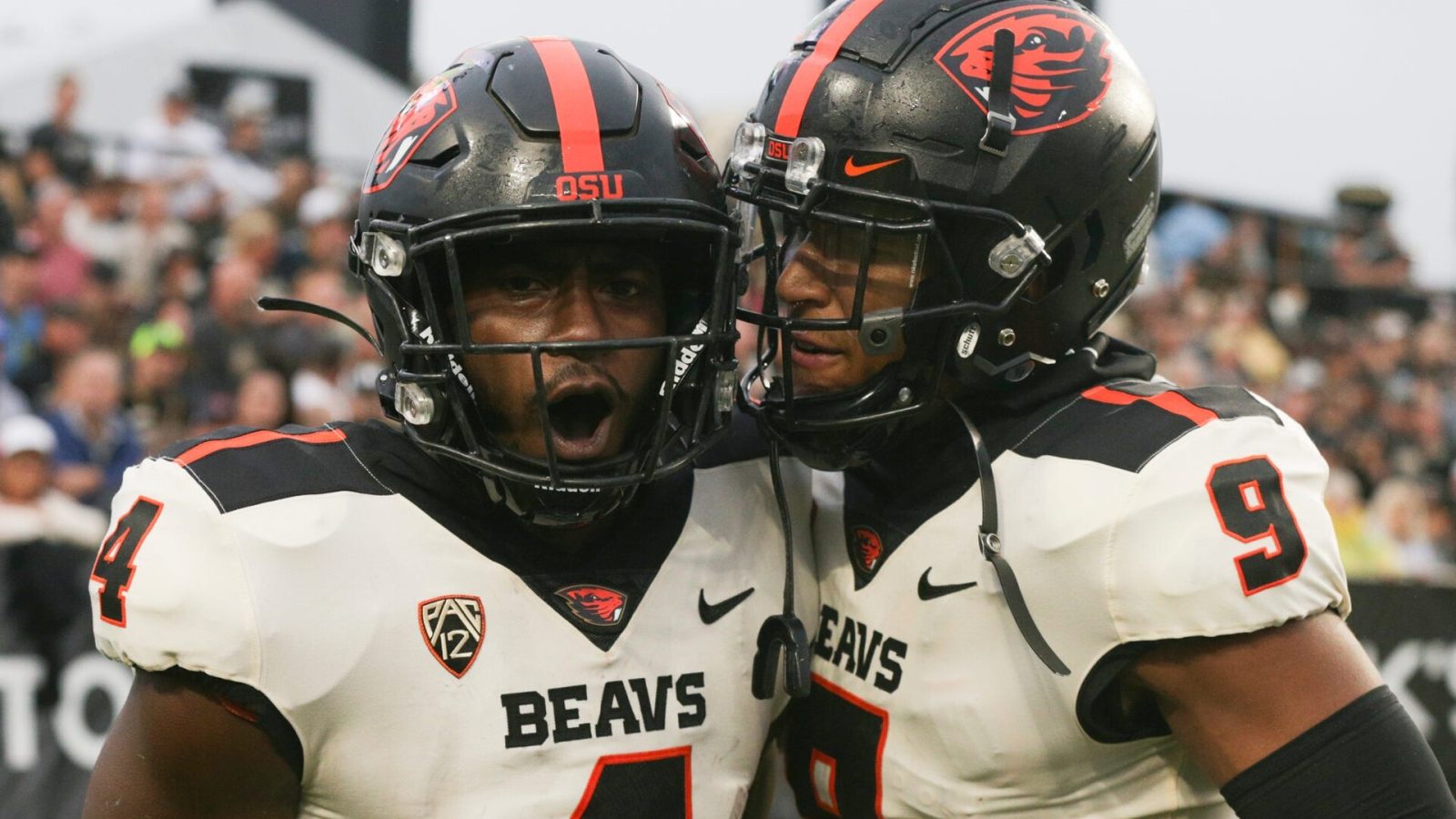 Oregon State football players celebrate during a 2021 regular-season game.