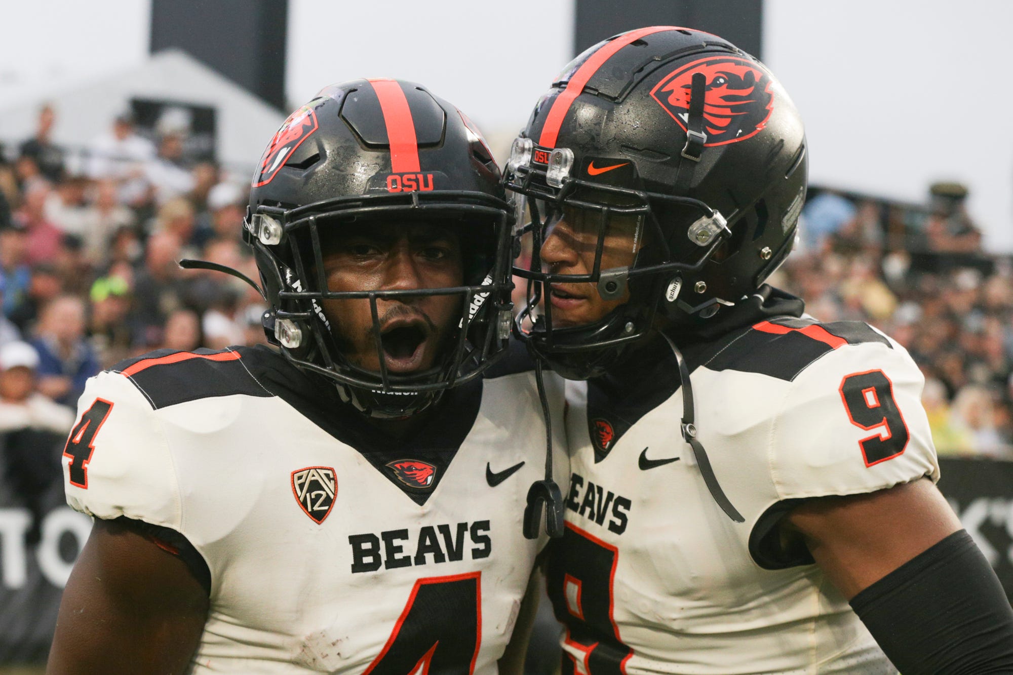 Oregon State football players celebrate during a 2021 regular-season game.
