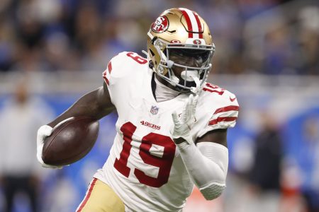 San Francisco wide receiver #19 Deebo Samuel tries to find running room in a 2021 road game.