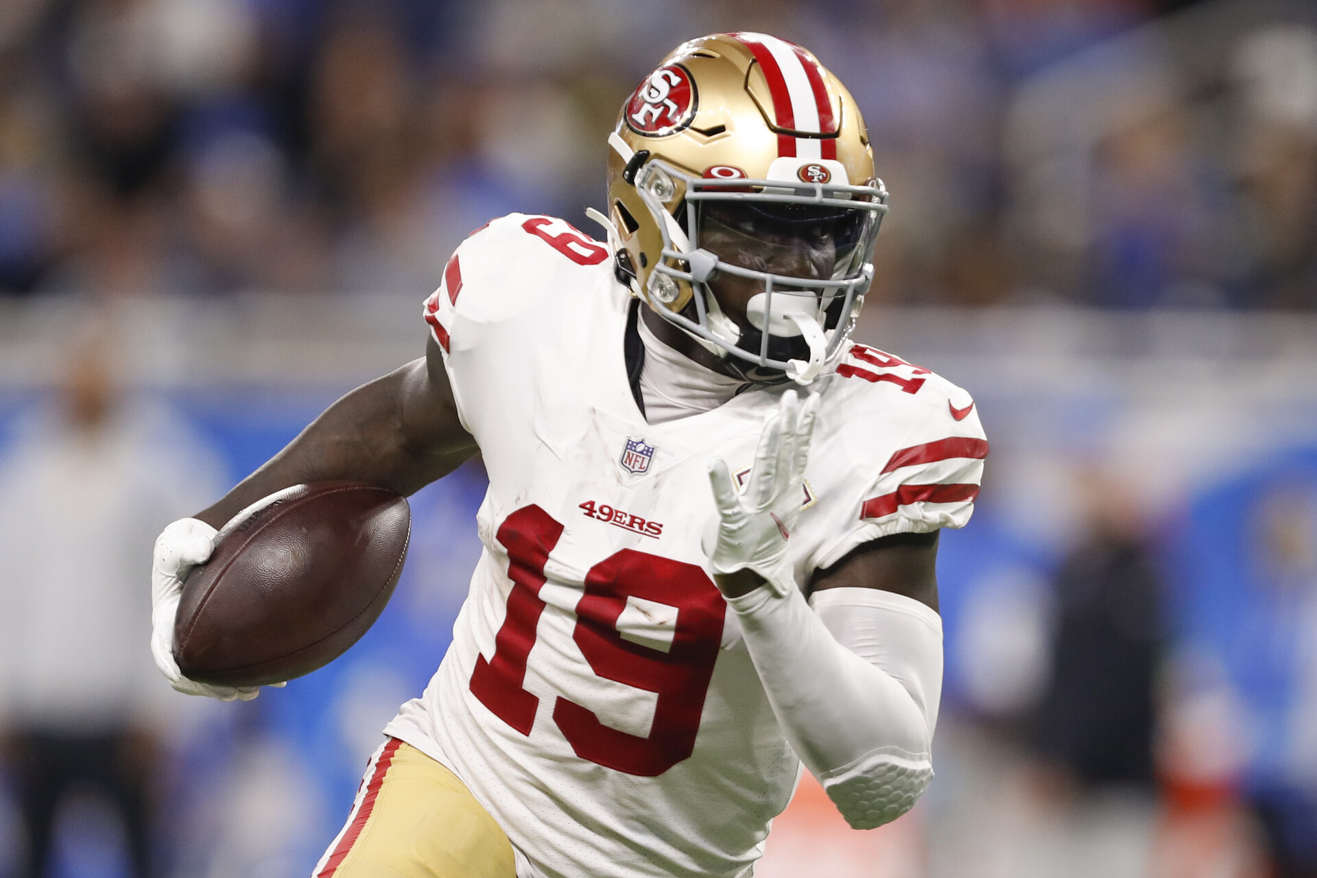 San Francisco wide receiver #19 Deebo Samuel tries to find running room in a 2021 road game.