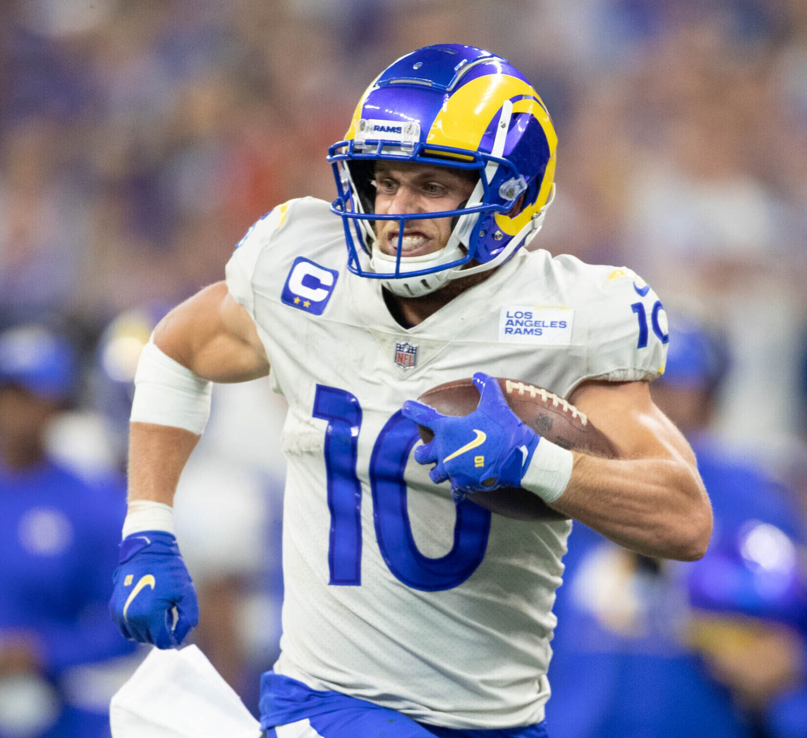 Los Angeles Rams wide receiver #10 Cooper Kupp runs down the sideline in a 2021 road game.