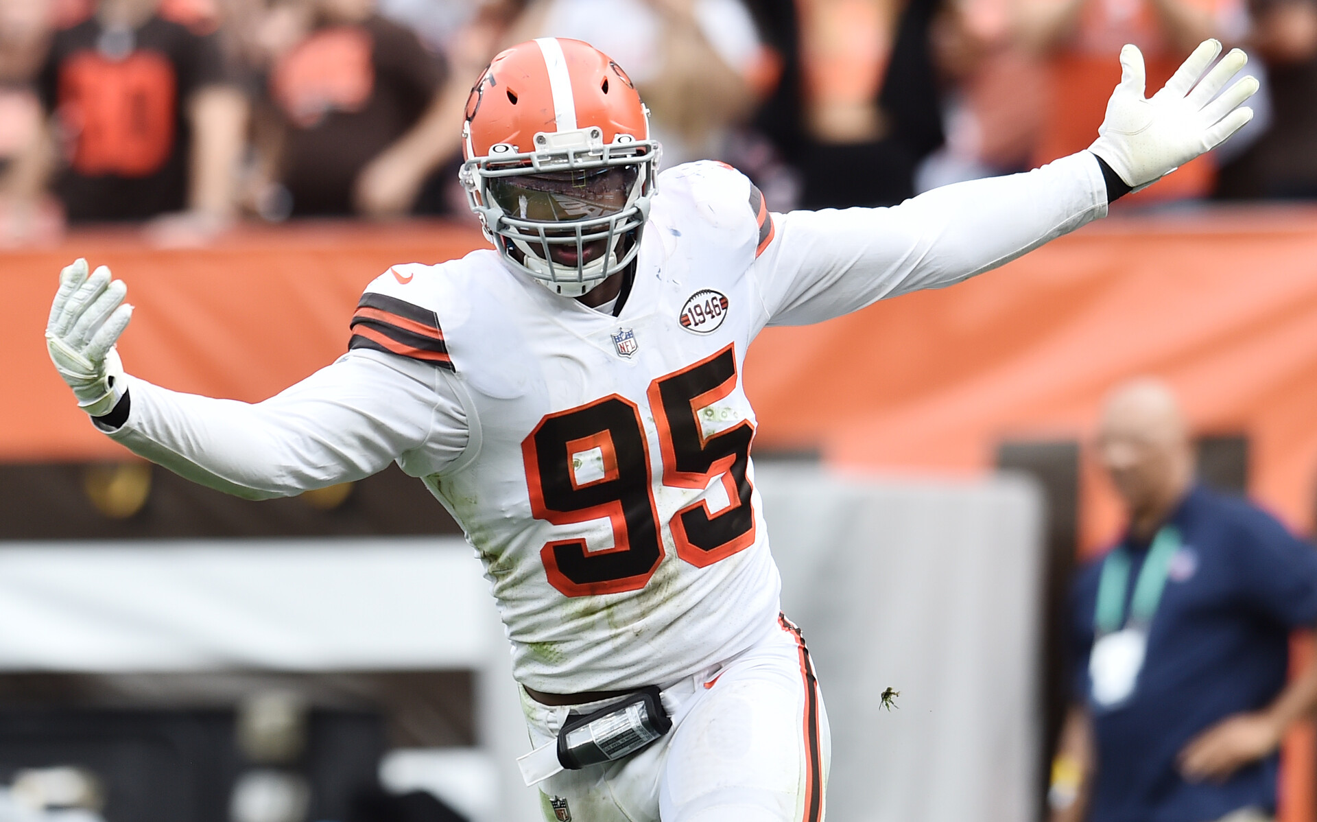 Myles Garrett #95 of the Cleveland Browns celebrates a sack in a 2021 home game.