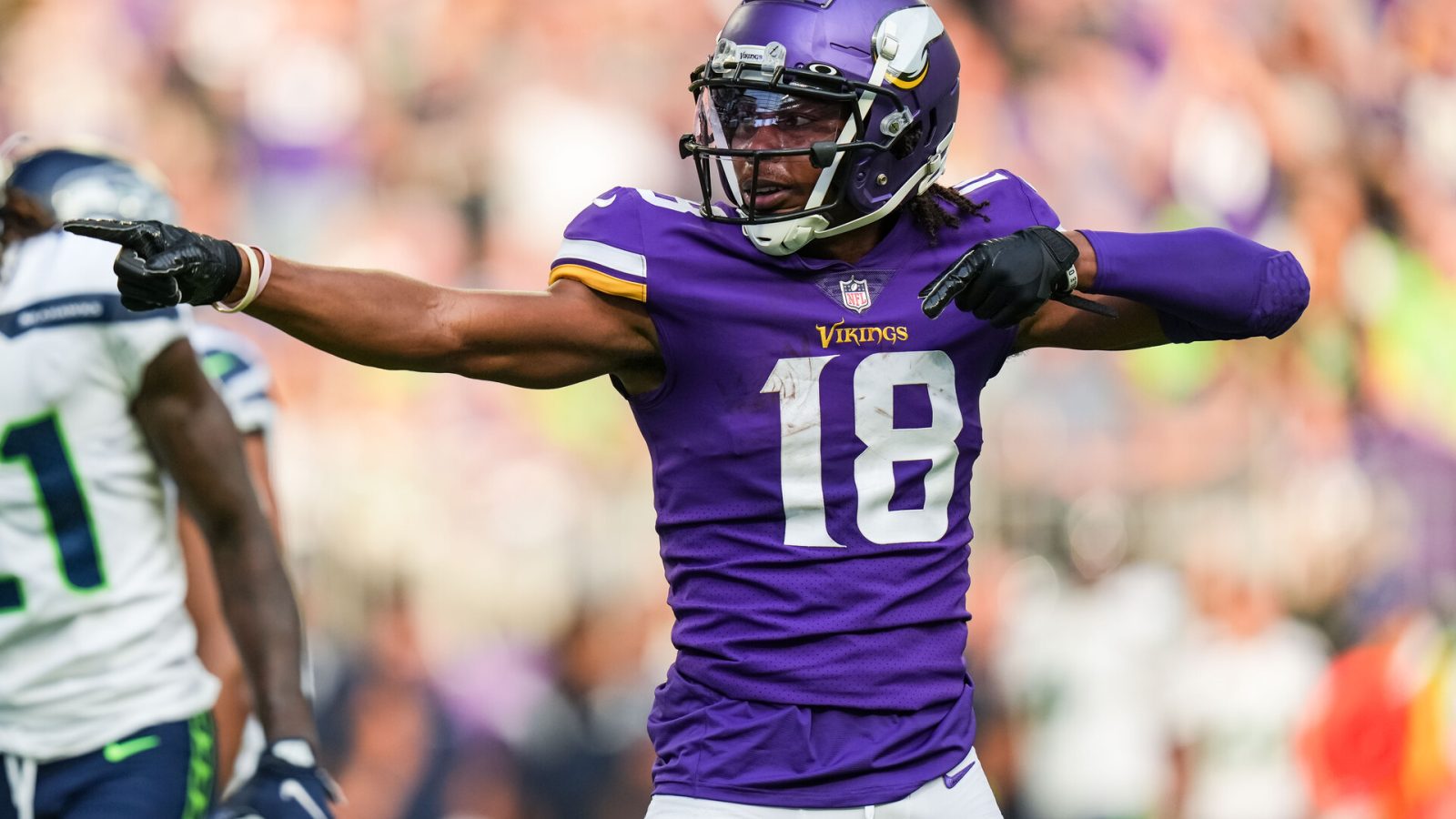 Minnesota Vikings wide receiver #18 Justin Jefferson celebrates a first down against the Seahawks.