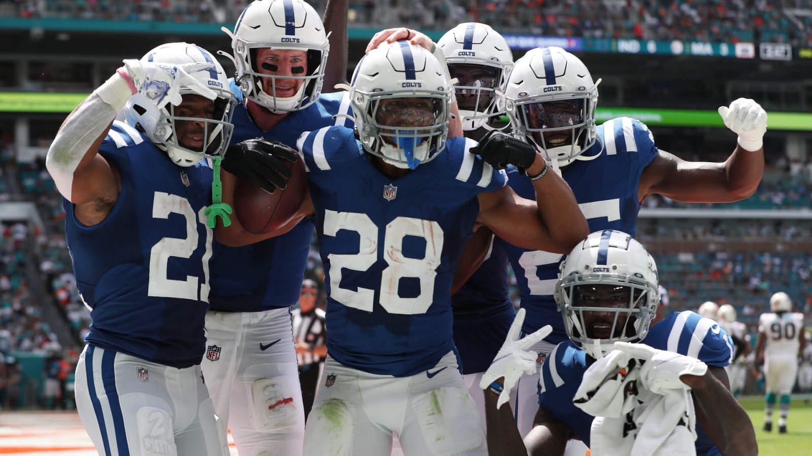 Jonathan Taylor and several Indianapolis Colts teammates celebrate during a 2021 regular-season NFL game