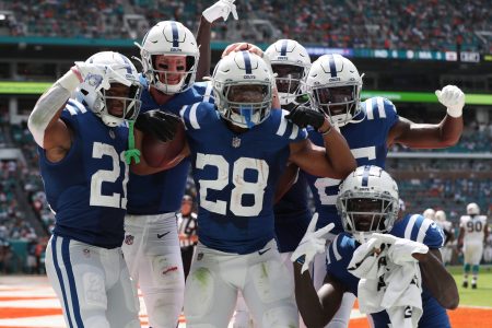 Jonathan Taylor and several Indianapolis Colts teammates celebrate during a 2021 regular-season NFL game