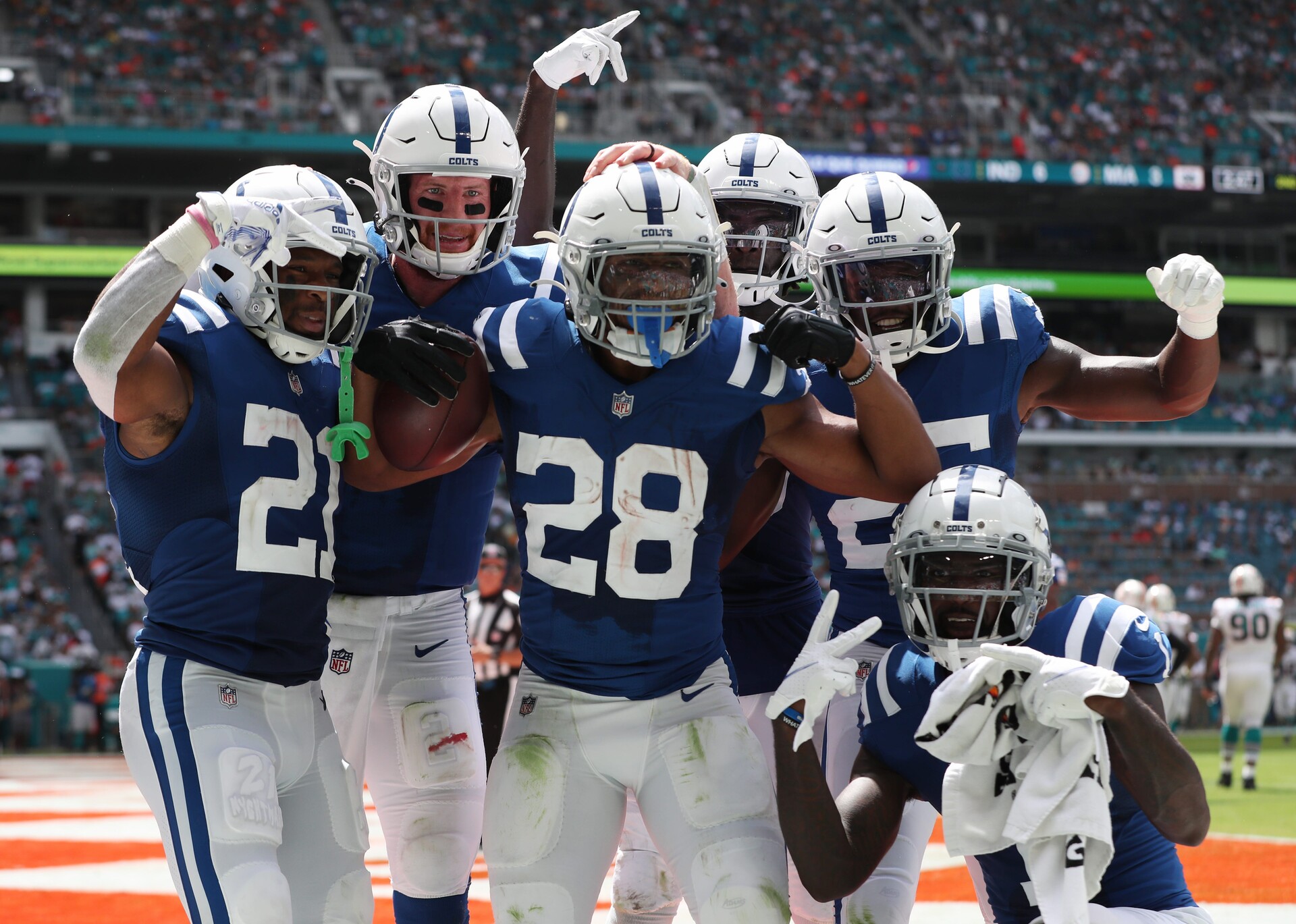 Jonathan Taylor and several Indianapolis Colts teammates celebrate during a 2021 regular-season NFL game