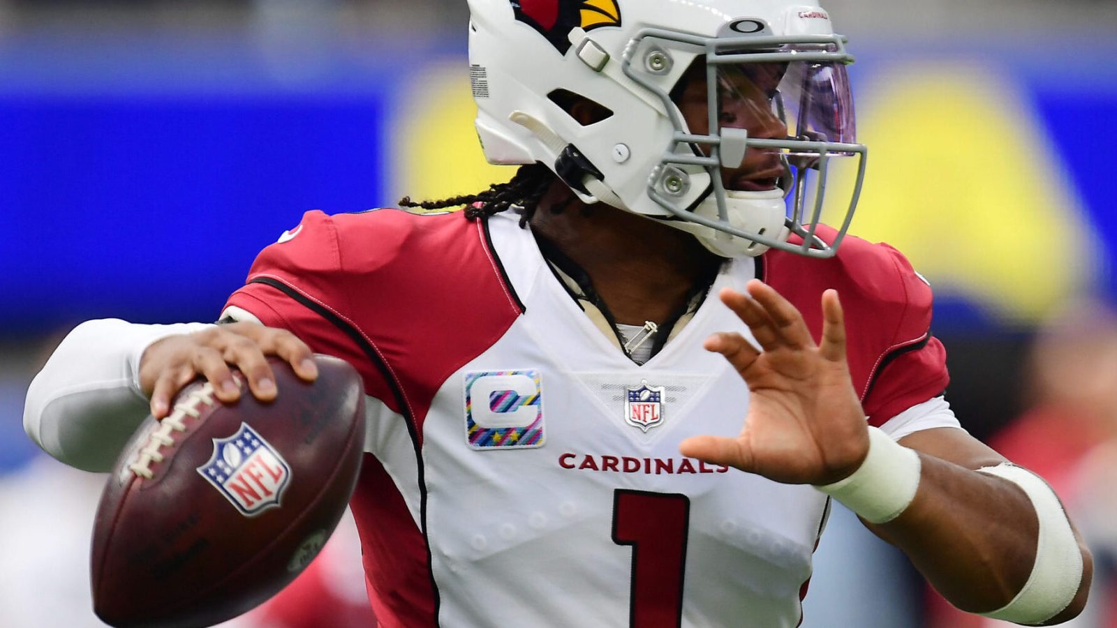 Arizona Cardinals quarterback Kyler Murray looks downfield to pass during a game in the 2021 regular season.