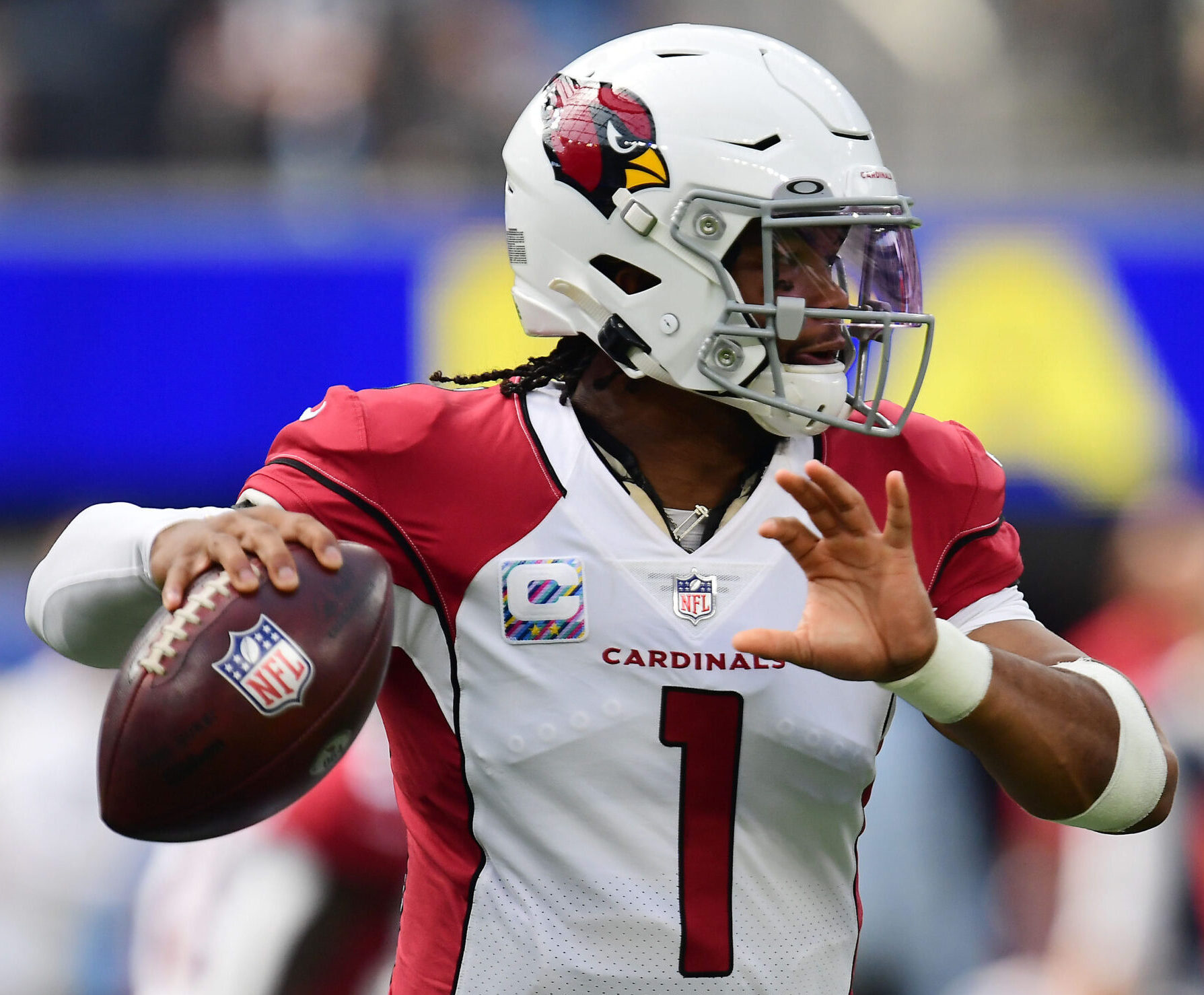 Arizona Cardinals quarterback Kyler Murray looks downfield to pass during a game in the 2021 regular season.