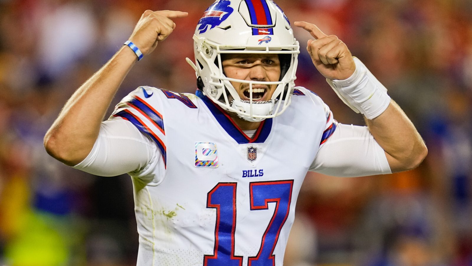 Buffalo Bills quarterback Josh Allen hollers out signals during a 2021-22 regular-season game.