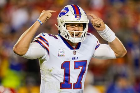 Buffalo Bills quarterback Josh Allen hollers out signals during a 2021-22 regular-season game.