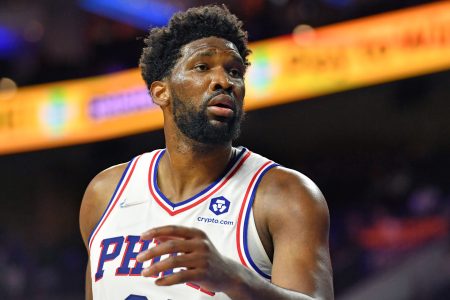 Philadelphia Sixers center #21 Joel Embiid reacts to a foul call in a 2021 home game.