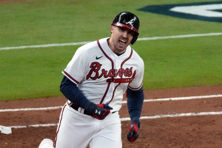 Atlanta Braves center fielder Adam Duvall hits a grand slam home run against the Houston Astros during the first inning of Game 5 of the 2021 World Series at Truist Park
