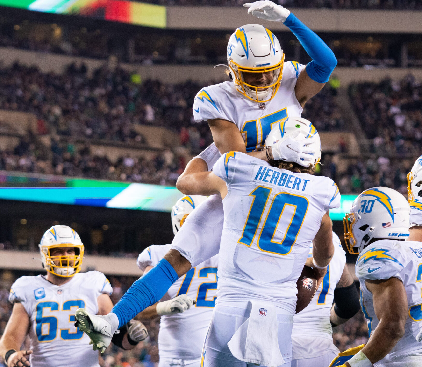 Los Angeles Chargers quarterback Justin Herbert (10) celebrates with wide receiver Jalen Guyton (15) after scoring a touchdown during the fourth quarter against the Philadelphia Eagles