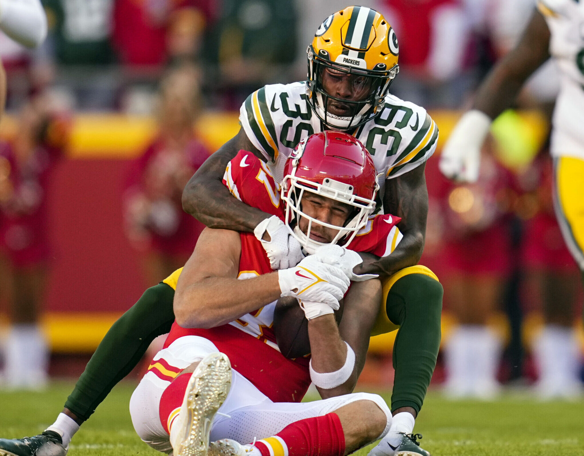 Travis Kelce is tackled by Green Bay Packers defensive back Chandon Sullivan