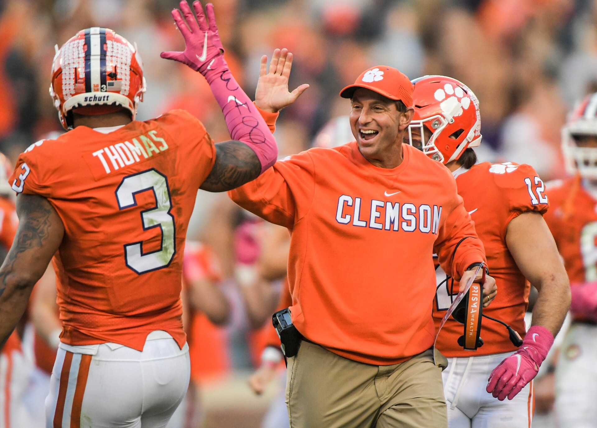 Clemson head coach Dabo Swinney celebrates a fumble recovery by Clemson safety Andrew Mukuba