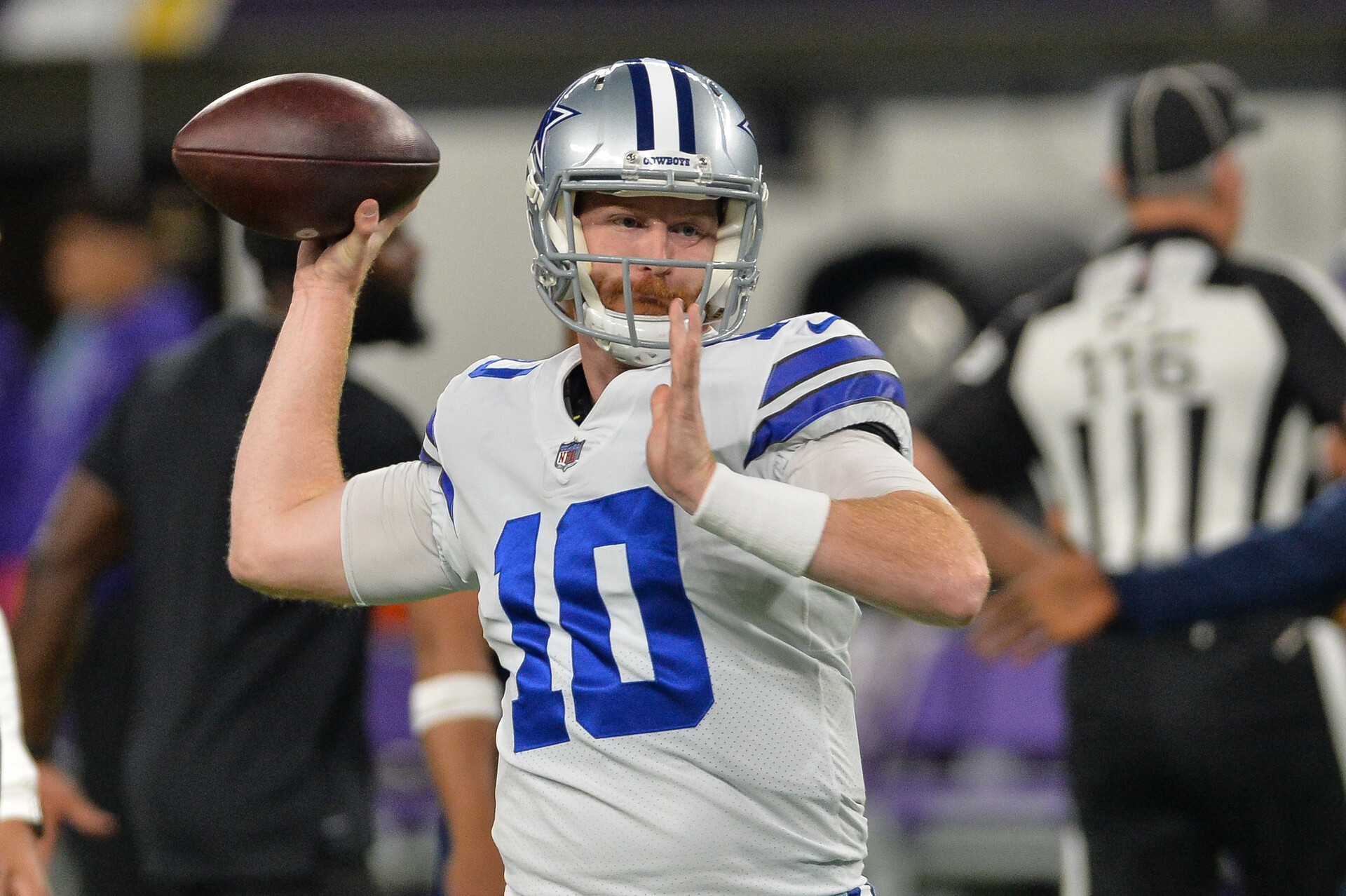 Dallas Cowboys quarterback Cooper Rush warms up before a game against the Minnesota Vikings