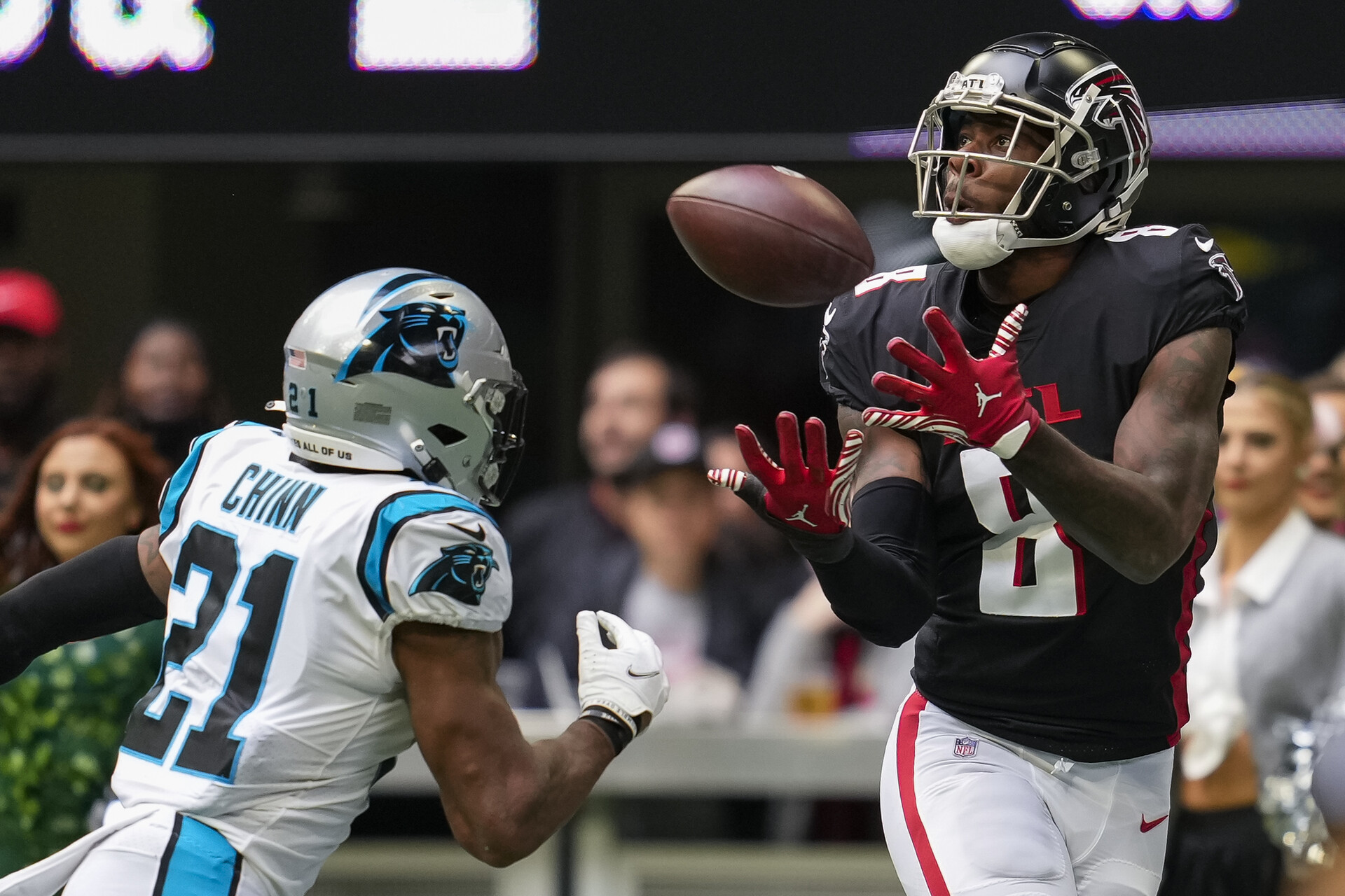 Kyle Pitts looks to make a catch against Carolina Panthers safety Jeremy Chinn