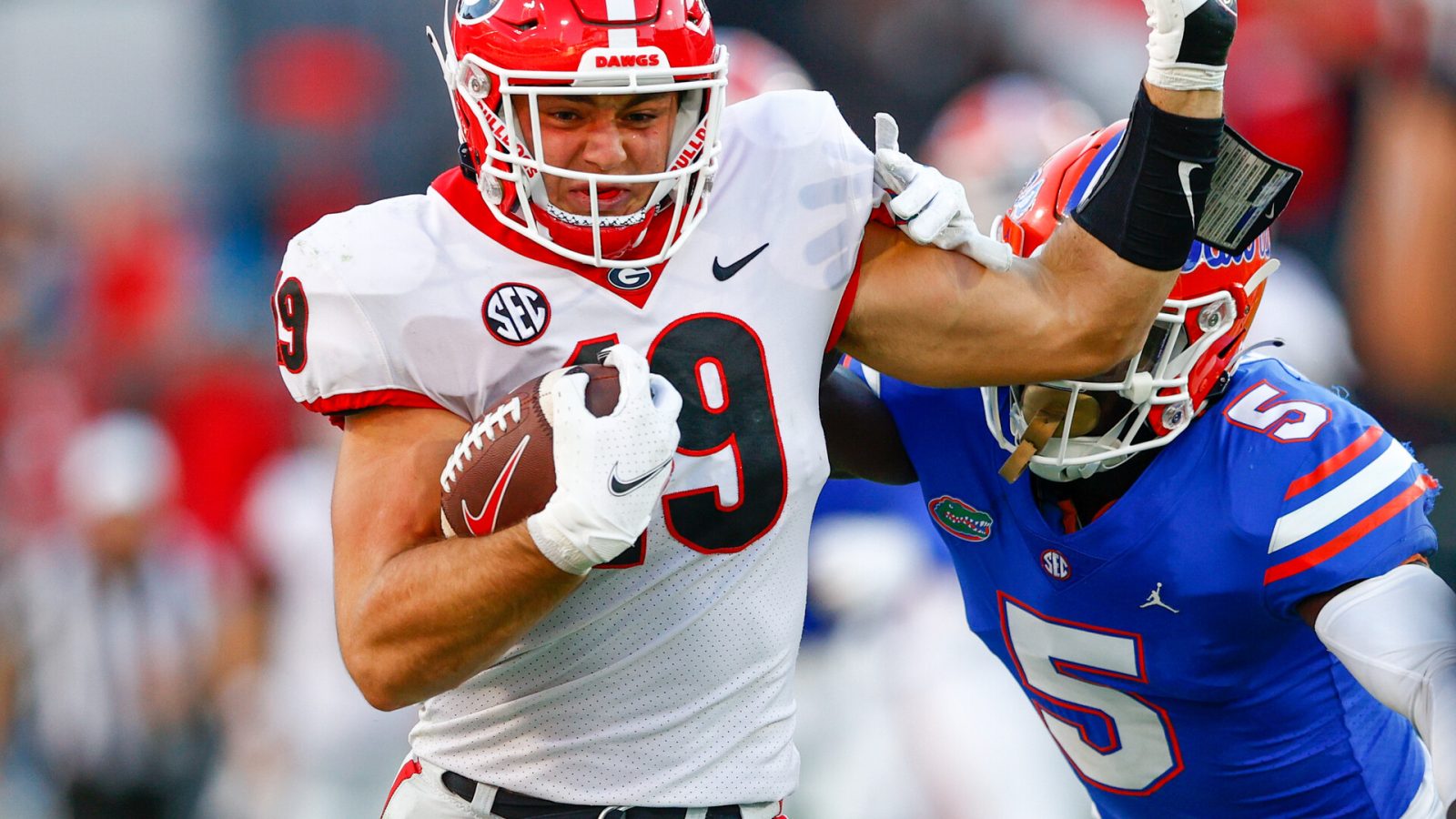 Georgia Bulldogs tight end Brock Bowers is forced out of bounds by Florida Gators cornerback Kaiir Elam