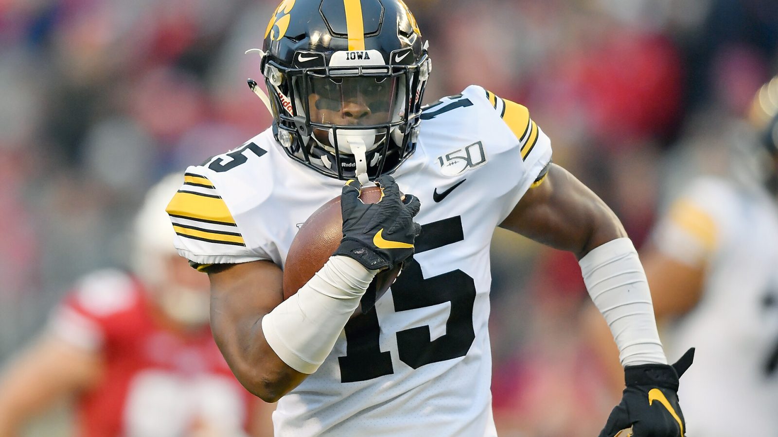 Tyler Goodson #15 of the Iowa Hawkeyes runs with the football in the first half against the Wisconsin Badgers at Camp Randall Stadium on November 09, 2019 in Madison, Wisconsin.
