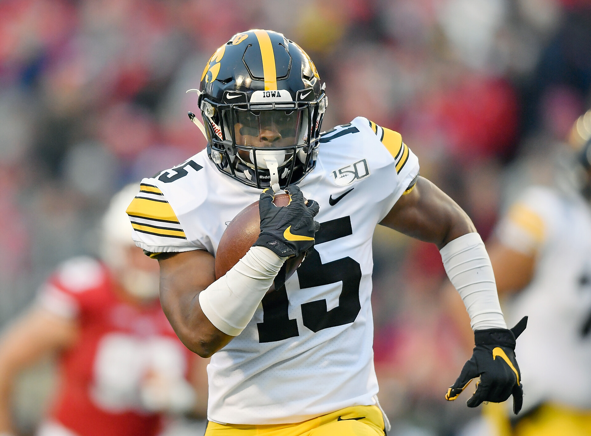 Tyler Goodson #15 of the Iowa Hawkeyes runs with the football in the first half against the Wisconsin Badgers at Camp Randall Stadium on November 09, 2019 in Madison, Wisconsin.