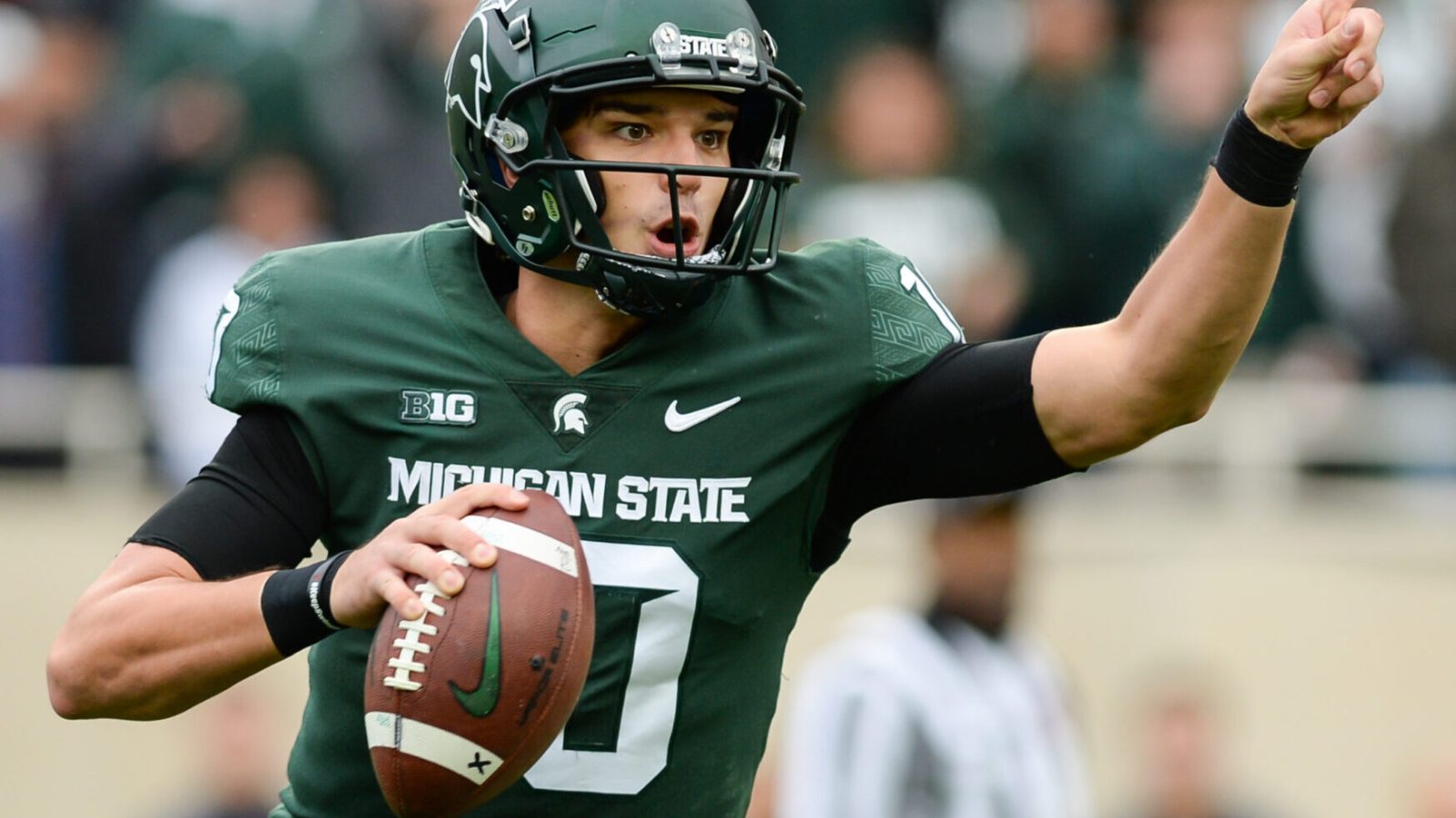 Michigan State - QB Payton Thorne looks to pass downfield against Michigan.